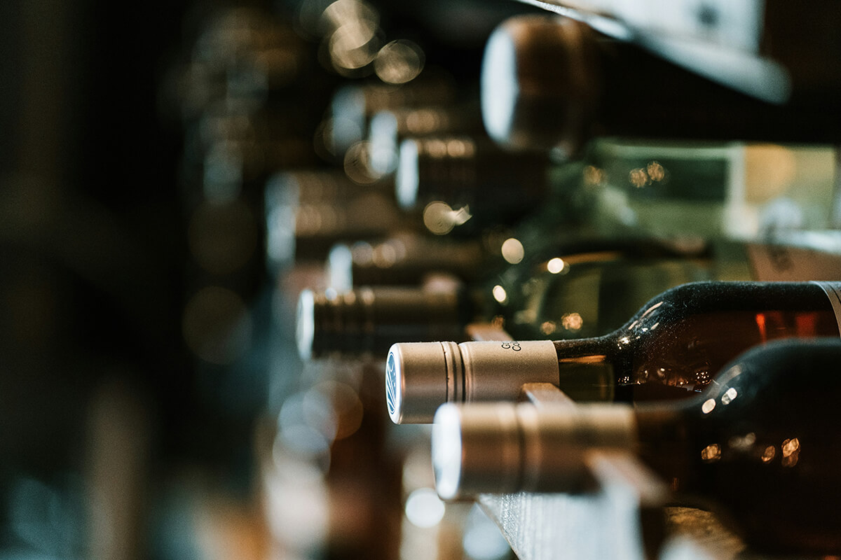 wine bottles stacked horizontally on a rack