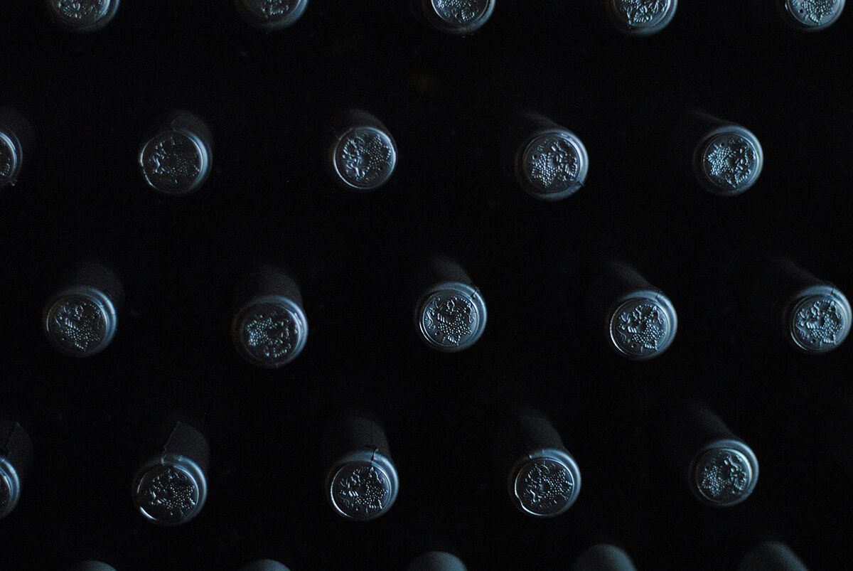 aesthetic wine bottles in the darkness