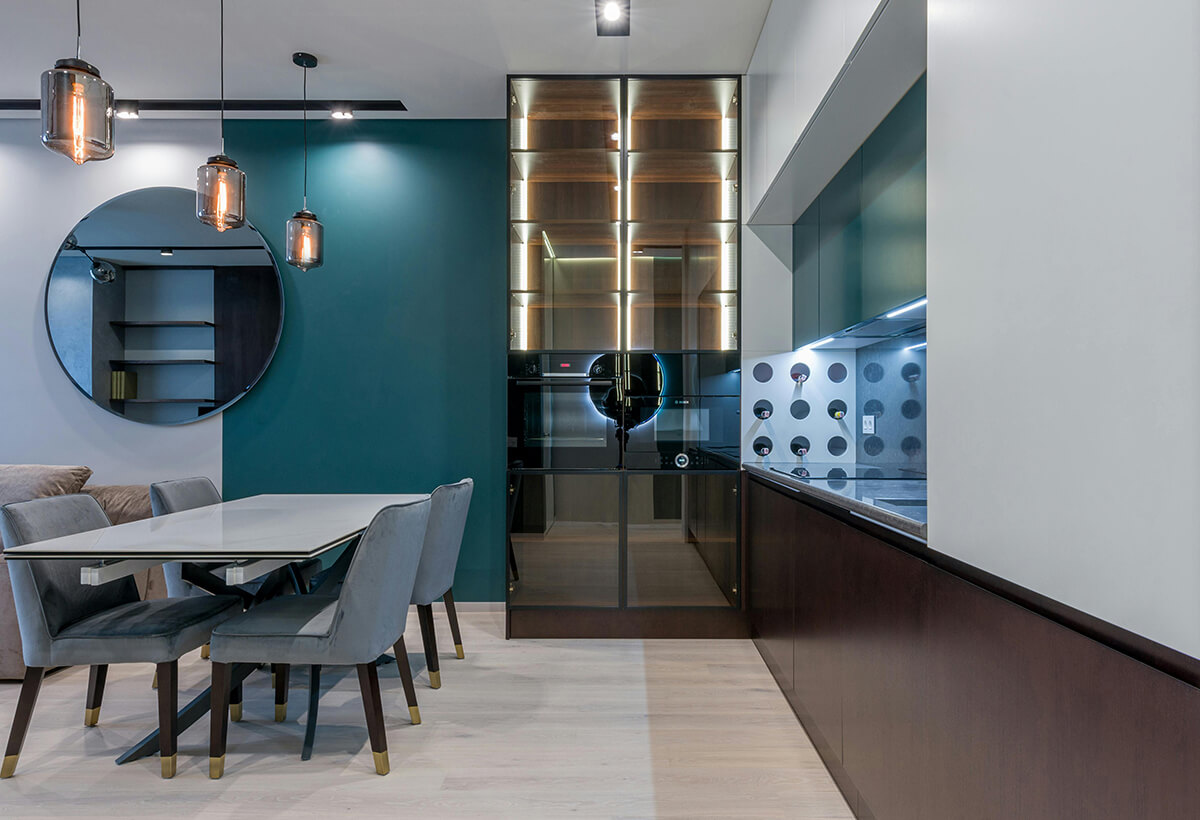 home kitchen with a modern wine fridge and wine rack