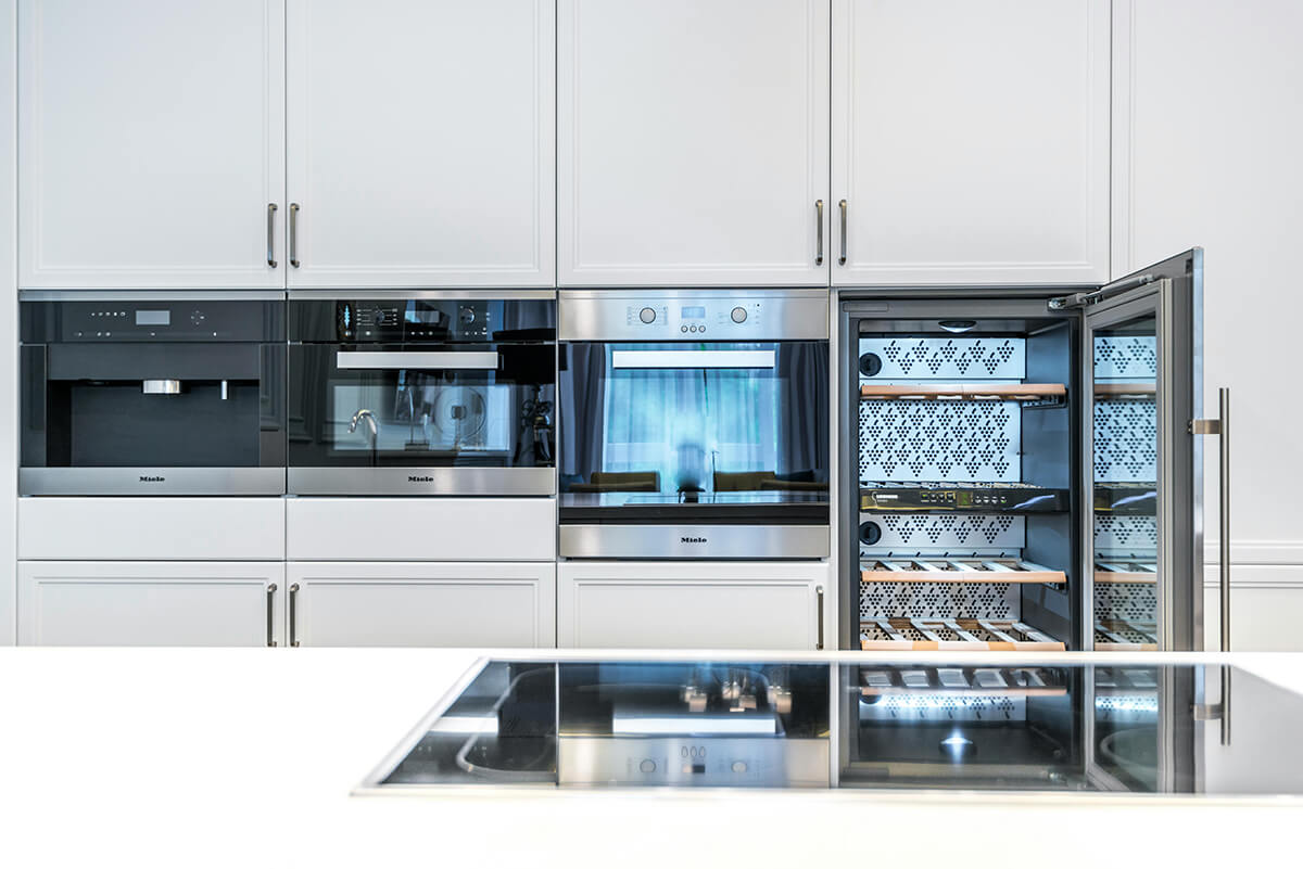 home kitchen with a modern wine fridge