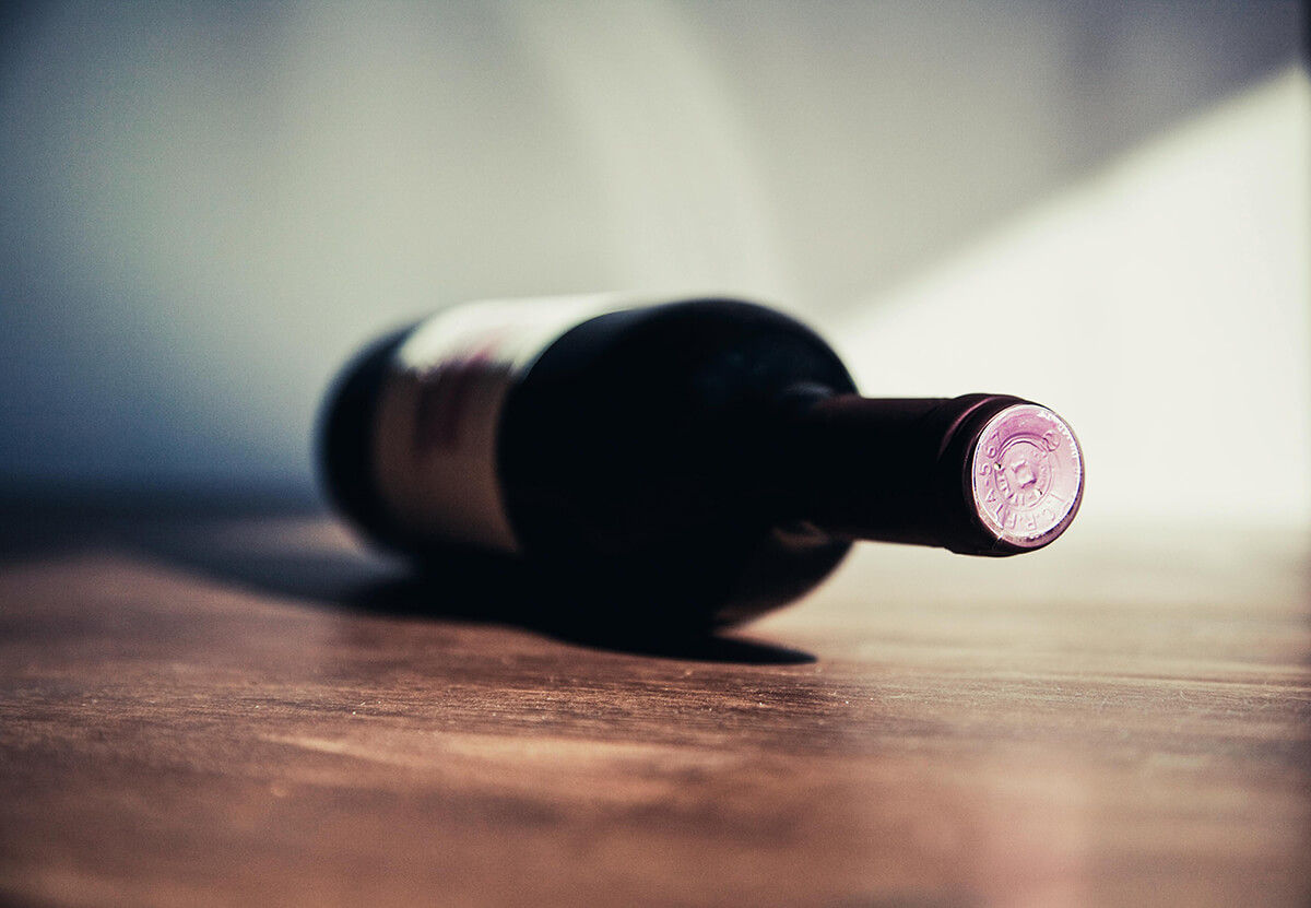 aesthetic wine bottle on a wooden table