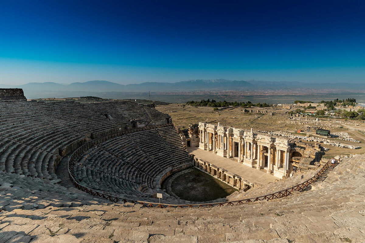 a roman amphitheatre at sunrise